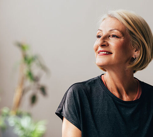 A portrait of a smiling retired Caucasian female contemplating while enjoying her leisure time.